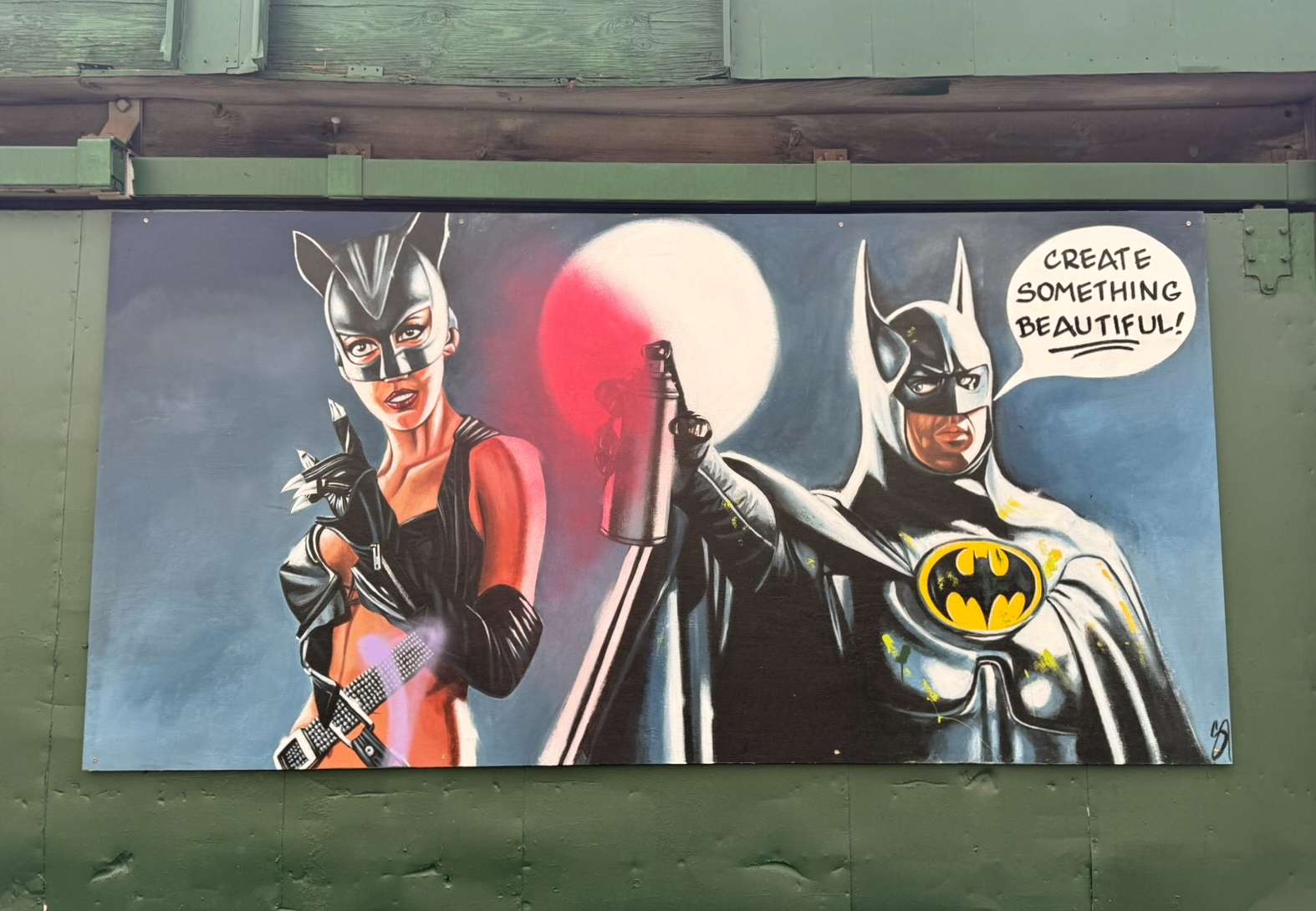 Alley Vigilante mural by Sean Marshall featuring Batman and Catwoman in a Ballpark District alley