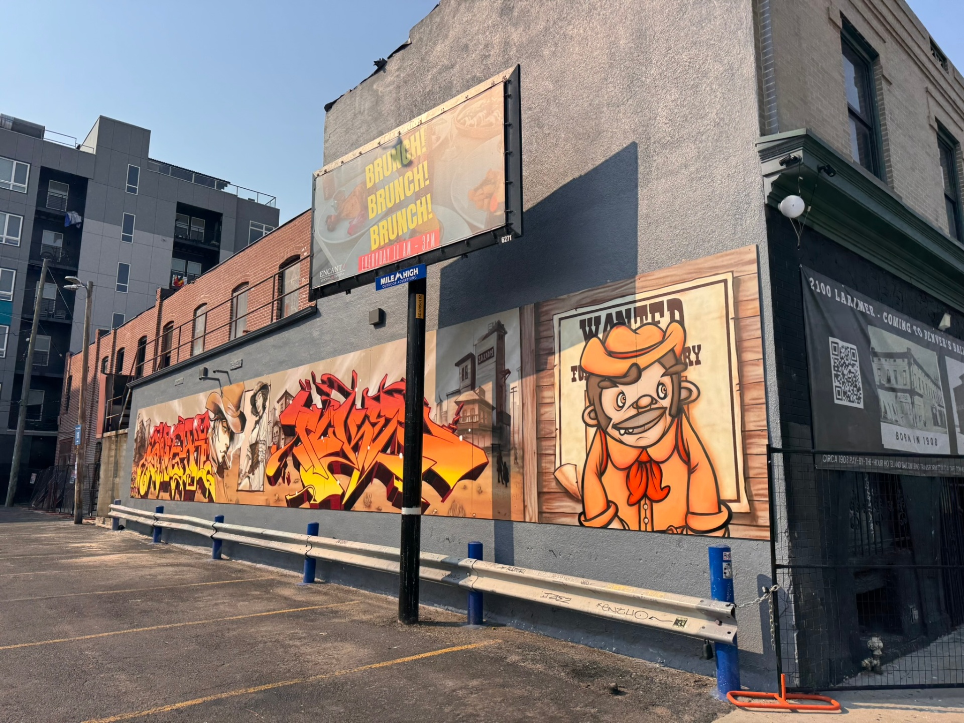 Wild Wild West graffiti mural wall along a Ballpark District parking lot