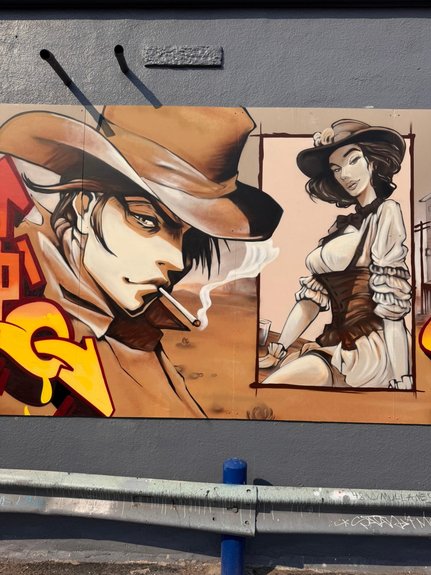Close-up of the Wild Wild West spray paint mural in the Ballpark District