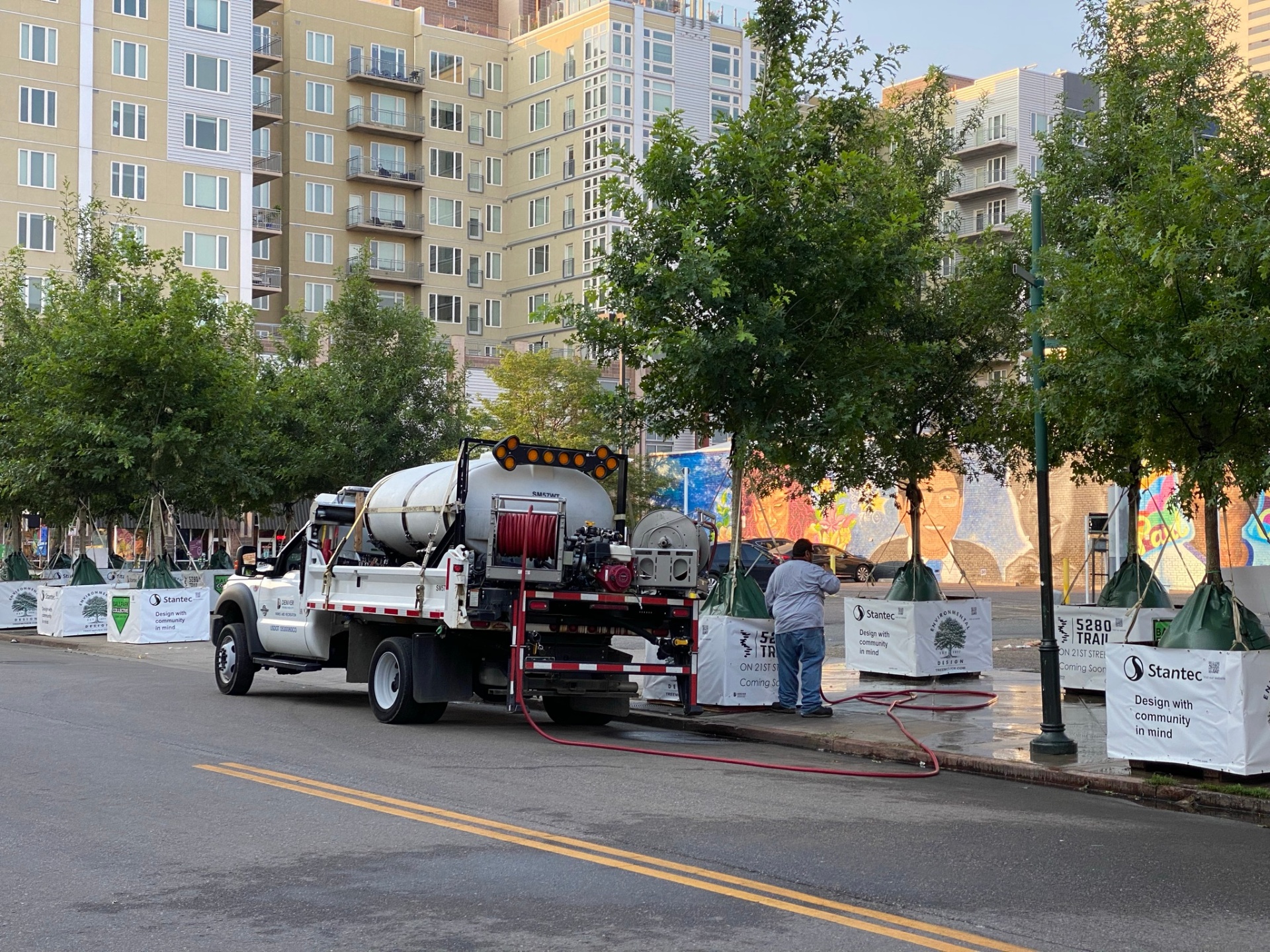 City crew watering newly planted trees along 21st Street in the Ballpark District